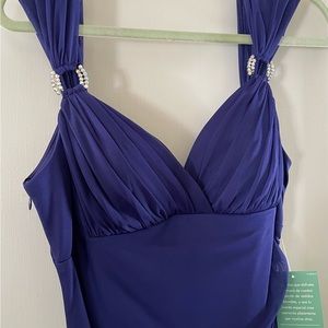 This is a beautiful,brand new,long gown with a sheer-overlay in a beautiful blue